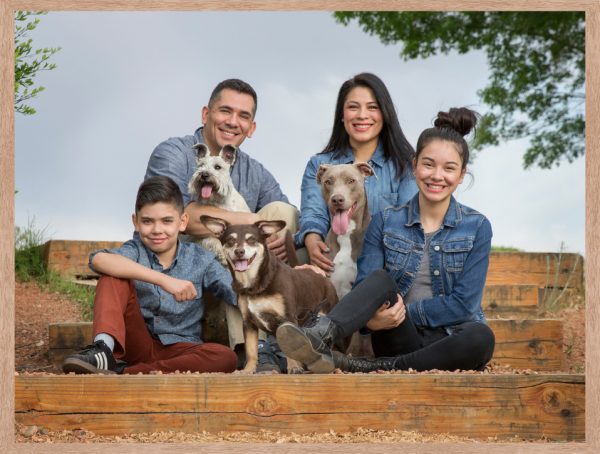 Family of four with three rescue dogs