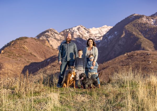 Family portrait with dogs in front of the Wasatch Front, Utah